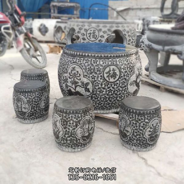景區庭院擺放休息圓形浮雕梅蘭菊竹花紋石桌石凳
