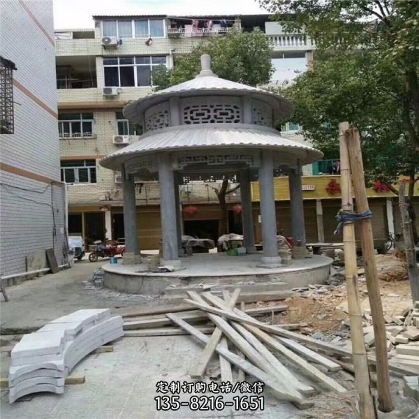 小區公園擺放青石仿古建圓形雙頂涼亭