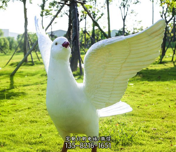 公園草坪創(chuàng)意玻璃鋼樹脂放飛的鴿子雕塑